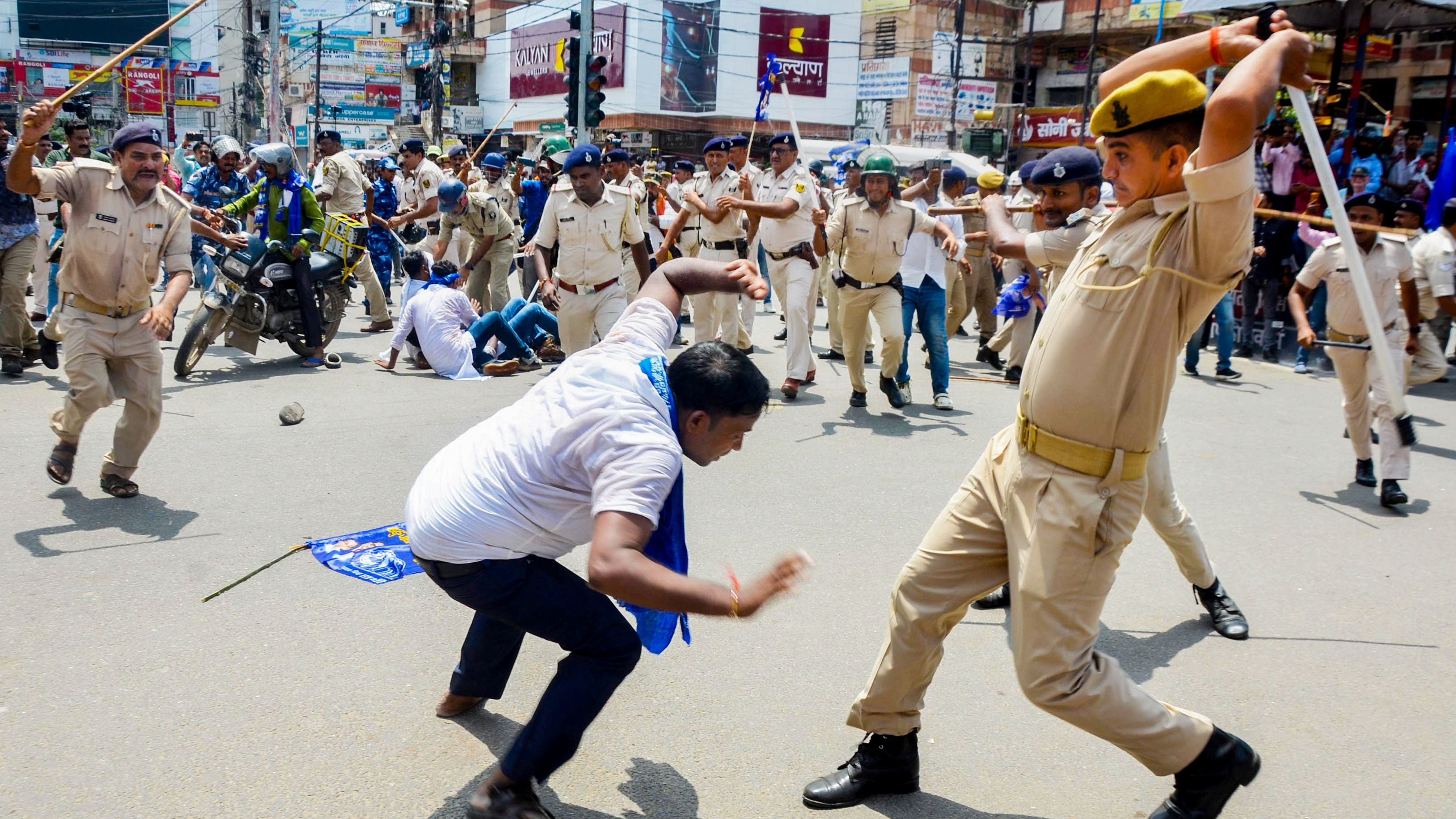 <div class="paragraphs"><p>Police personnel lathi-charge protestors during the 'Bharat Bandh' called by SC/ST organisations over reservation issue, in Patna, Wednesday.</p></div>